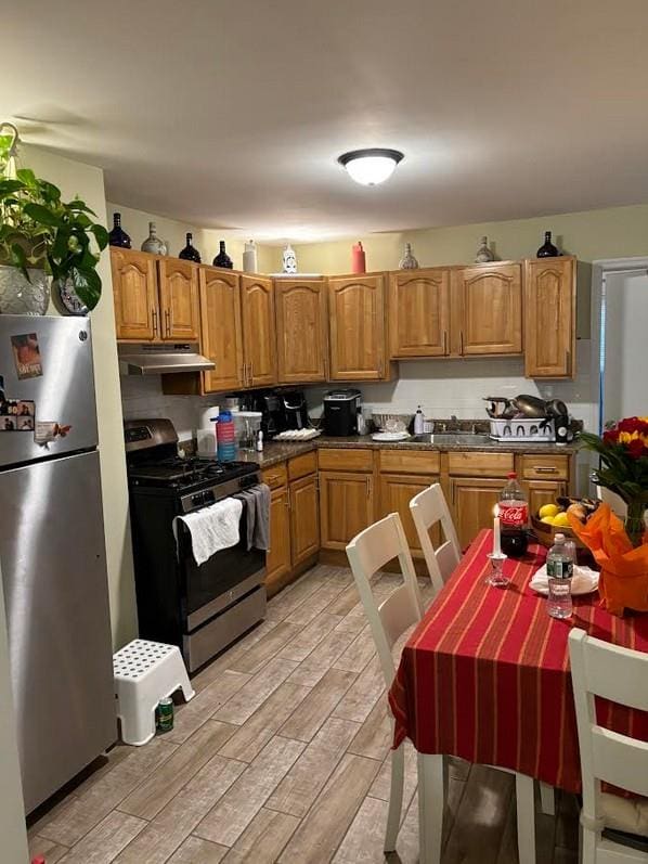 kitchen featuring light hardwood / wood-style flooring and appliances with stainless steel finishes