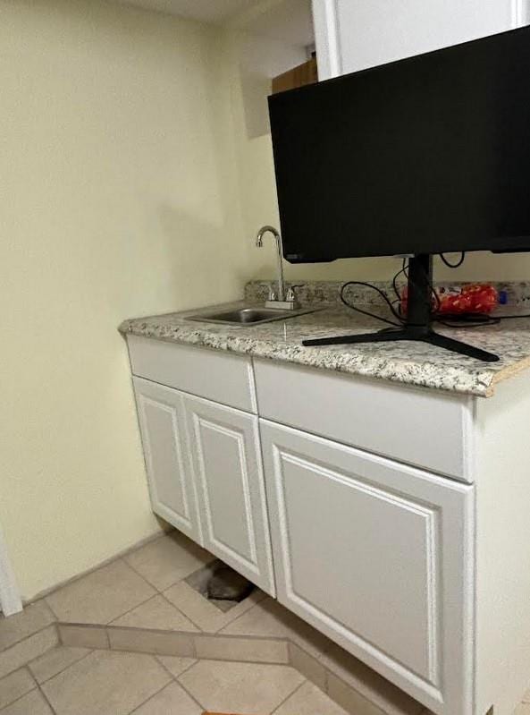 bathroom featuring tile patterned flooring and sink