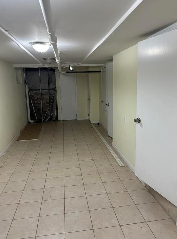 basement with light tile patterned floors