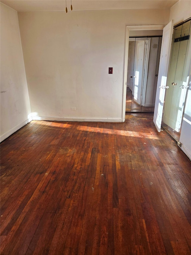 unfurnished room featuring dark hardwood / wood-style floors