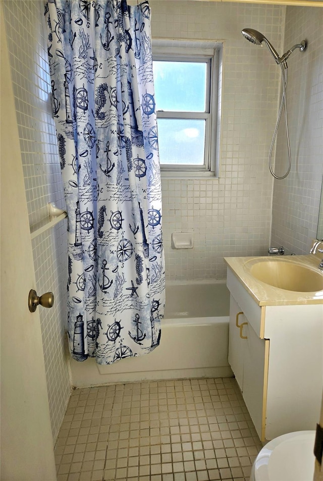 full bathroom with tile patterned floors, vanity, toilet, and shower / bathtub combination with curtain