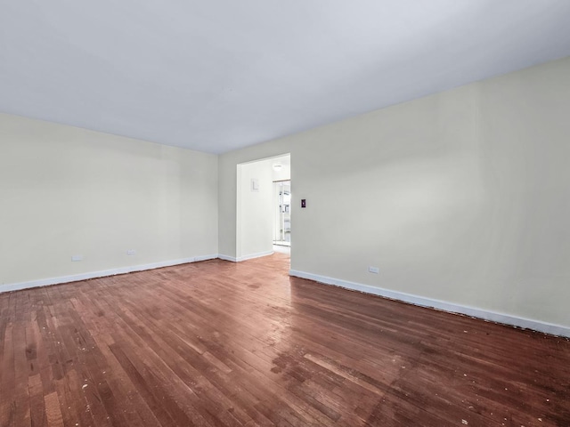 empty room featuring wood-type flooring