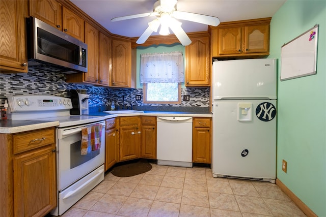 kitchen featuring tasteful backsplash, ceiling fan, light tile patterned floors, and white appliances