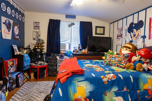 bedroom featuring hardwood / wood-style floors, cooling unit, ceiling fan, and lofted ceiling