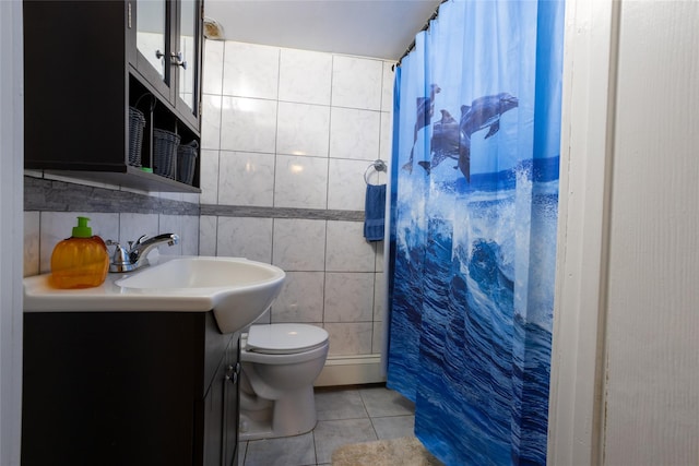 bathroom with tile patterned floors, a shower with curtain, vanity, tile walls, and toilet