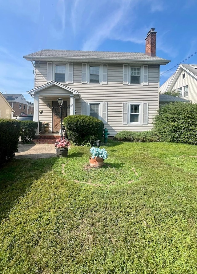 view of front of house with a front lawn