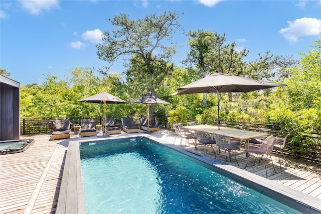 view of pool featuring a wooden deck