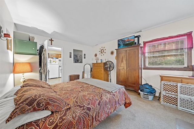 carpeted bedroom featuring white refrigerator