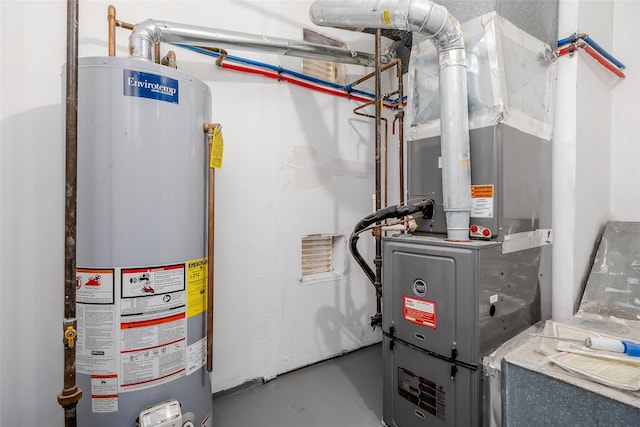 utility room featuring heating unit and gas water heater