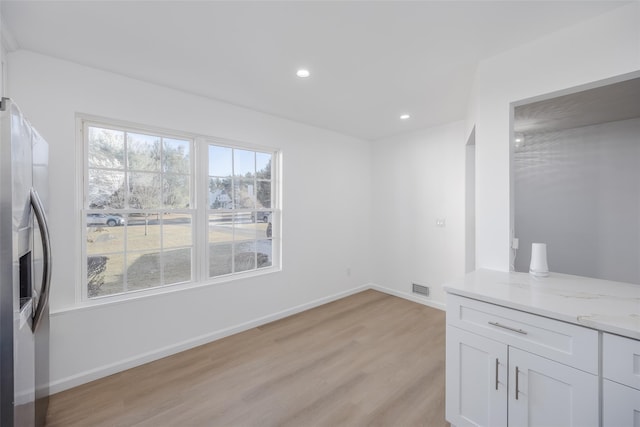 dining room with light hardwood / wood-style flooring