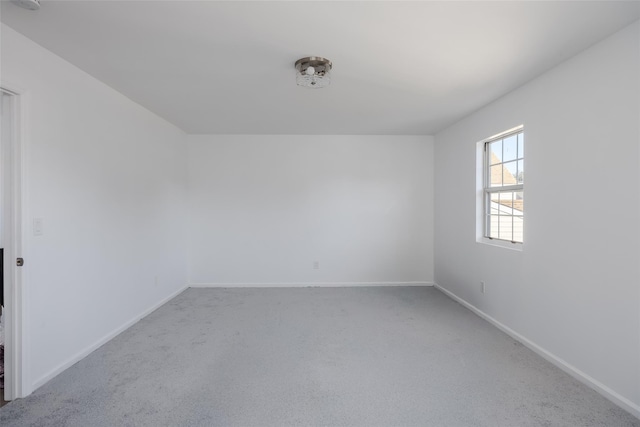 unfurnished room featuring carpet