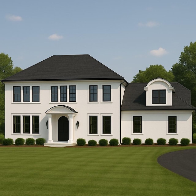 view of front of home with a front lawn and stucco siding