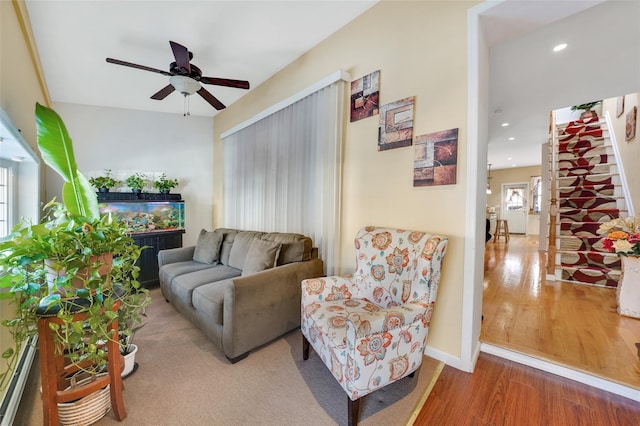 living room with ceiling fan and wood-type flooring