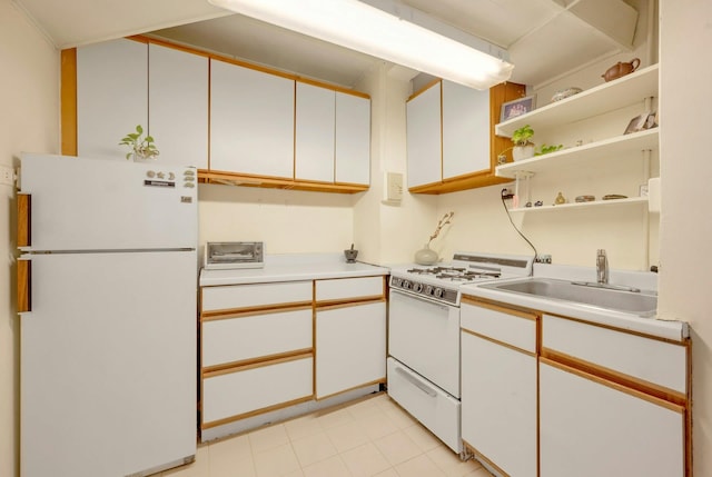 kitchen with white cabinets, white appliances, and sink