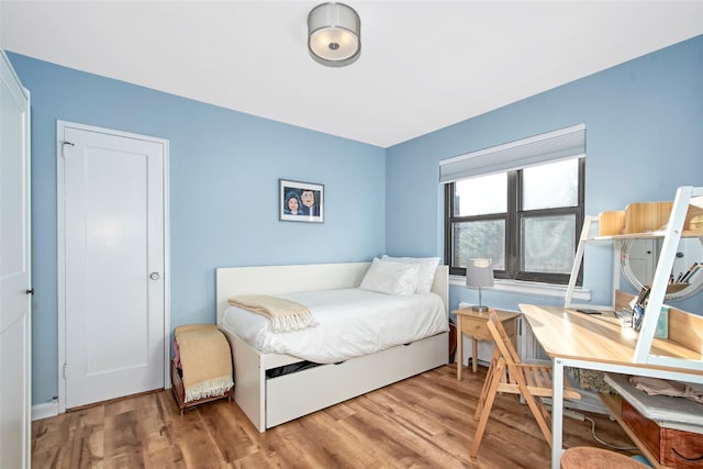 bedroom featuring hardwood / wood-style floors