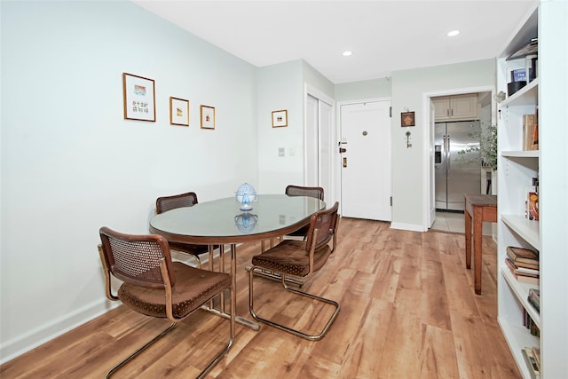 dining room with light wood-type flooring