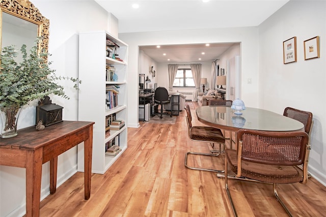 dining space featuring light wood-type flooring