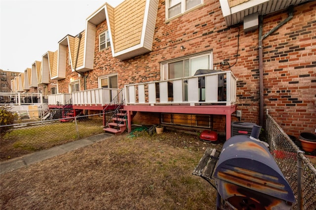 exterior space with central air condition unit and a deck