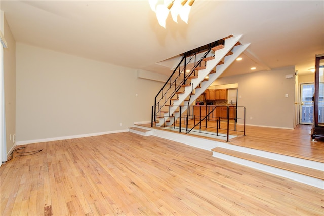 unfurnished living room with light wood-type flooring