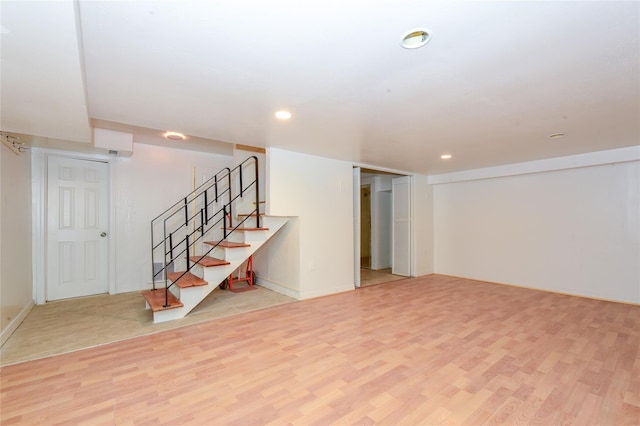 basement featuring light hardwood / wood-style floors