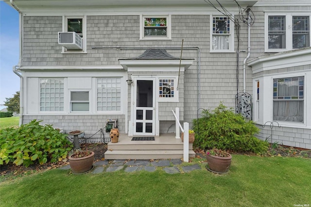 exterior space featuring cooling unit and a lawn
