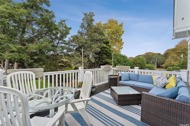 wooden terrace featuring outdoor lounge area