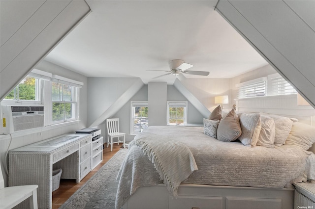 bedroom featuring cooling unit, a ceiling fan, and wood finished floors