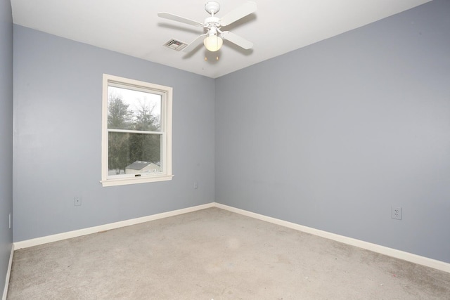 carpeted empty room with ceiling fan