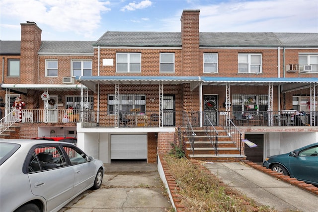 townhome / multi-family property featuring a garage