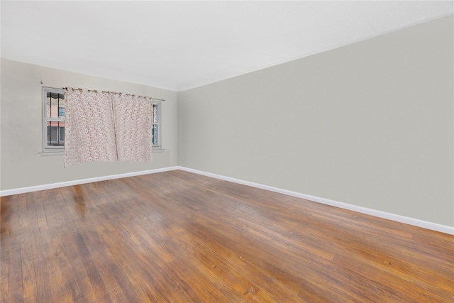 empty room featuring hardwood / wood-style flooring