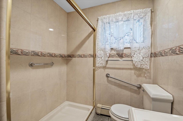 bathroom with toilet, a baseboard radiator, tile walls, and tiled shower