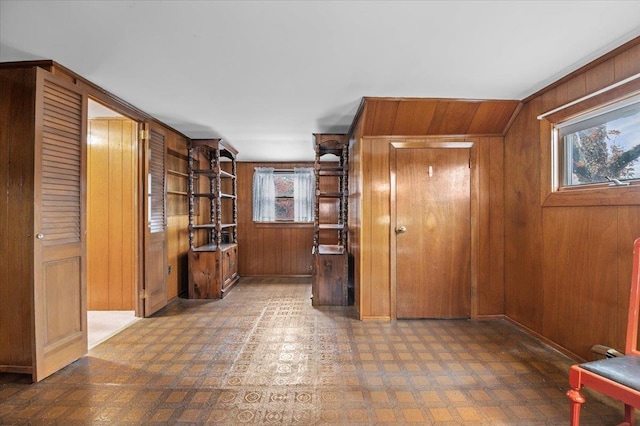 interior space featuring wooden walls