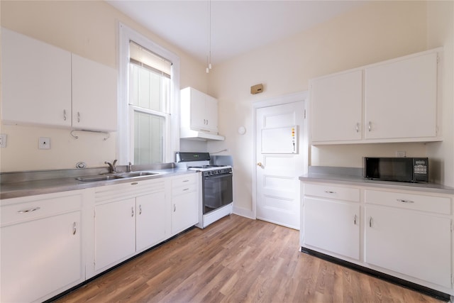 kitchen featuring white cabinets, sink, and white gas range oven