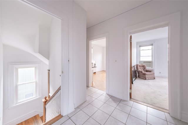 hallway featuring cooling unit and light carpet