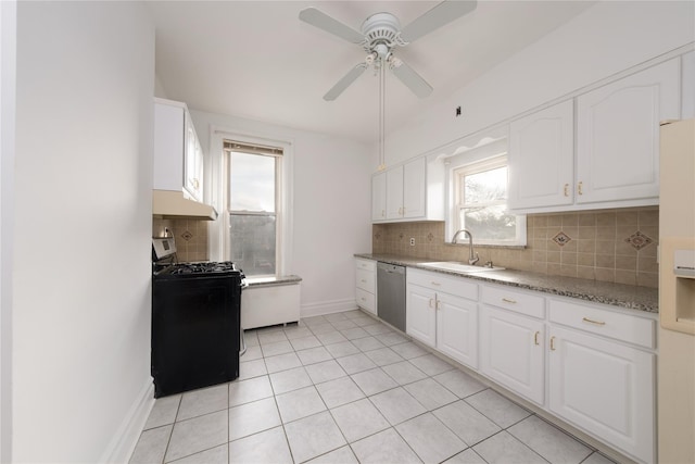 kitchen featuring dishwasher, black stove, white cabinets, and sink