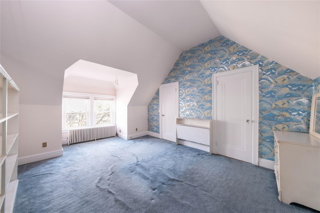 additional living space featuring carpet flooring, lofted ceiling, and radiator heating unit