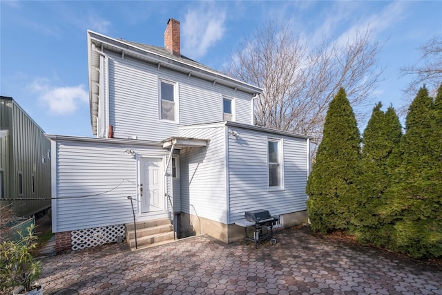 back of property with a patio area