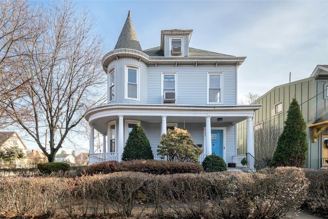 victorian house featuring a porch