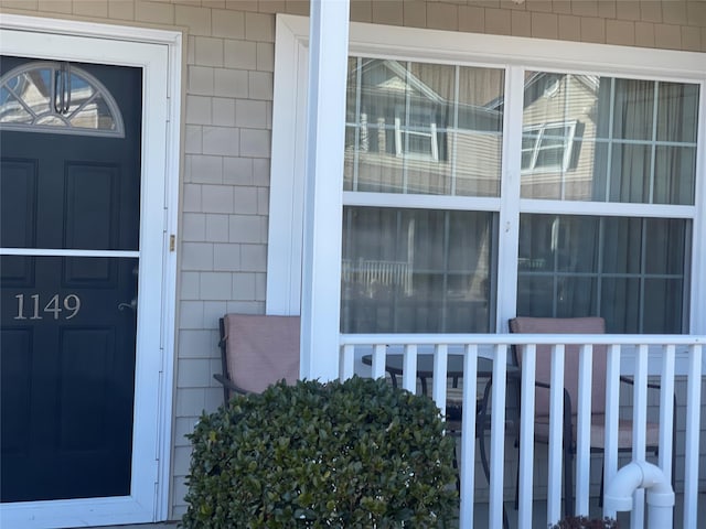 doorway to property featuring a porch