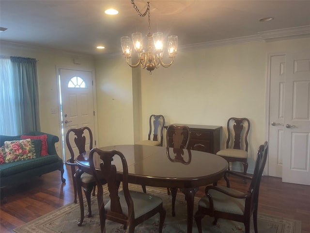 dining space with recessed lighting, crown molding, and wood finished floors