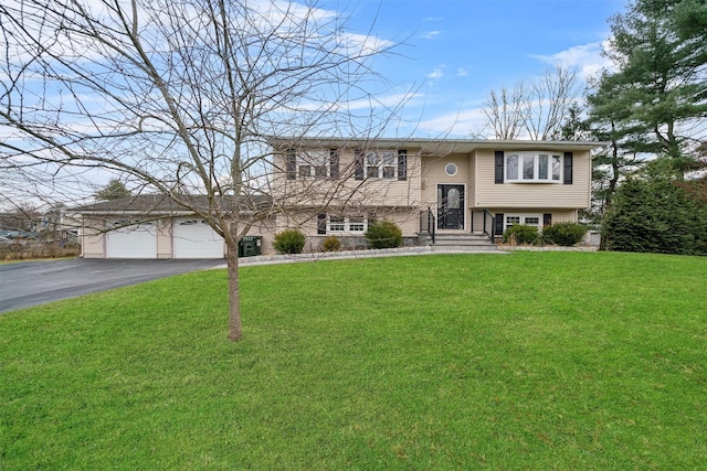 bi-level home with a front yard and a garage