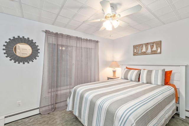 bedroom featuring ceiling fan, carpet, and a baseboard heating unit