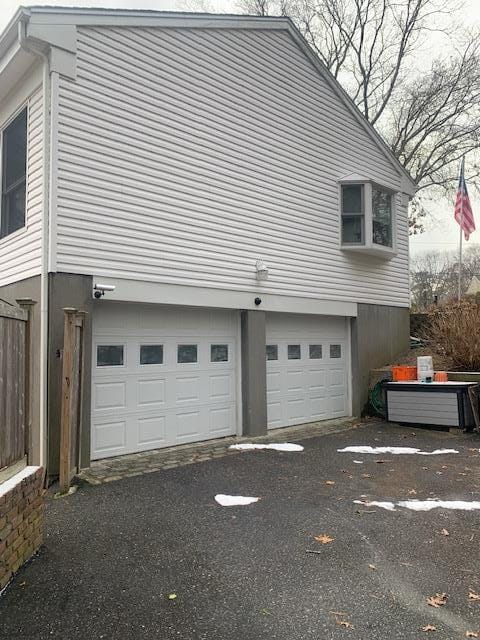 view of property exterior with a garage