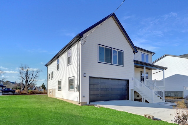 exterior space with a porch, a garage, and a lawn