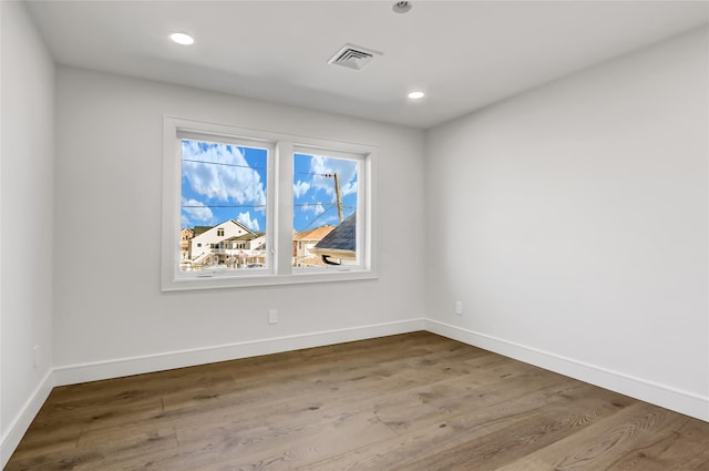 empty room featuring hardwood / wood-style floors