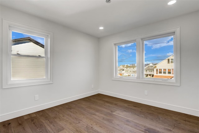 empty room featuring hardwood / wood-style floors