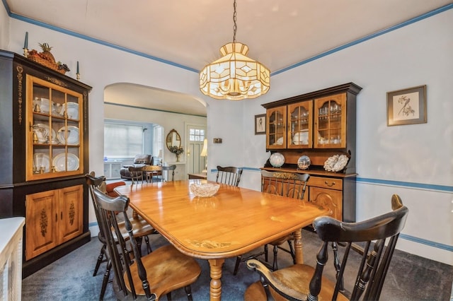 dining space with dark carpet