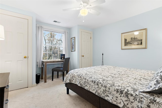 bedroom featuring ceiling fan and light colored carpet