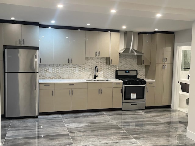 kitchen featuring decorative backsplash, stainless steel appliances, wall chimney exhaust hood, and sink