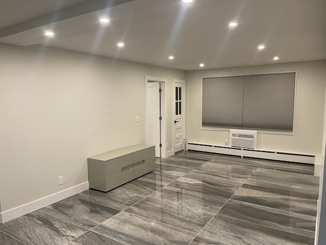 interior space featuring an AC wall unit and a baseboard radiator